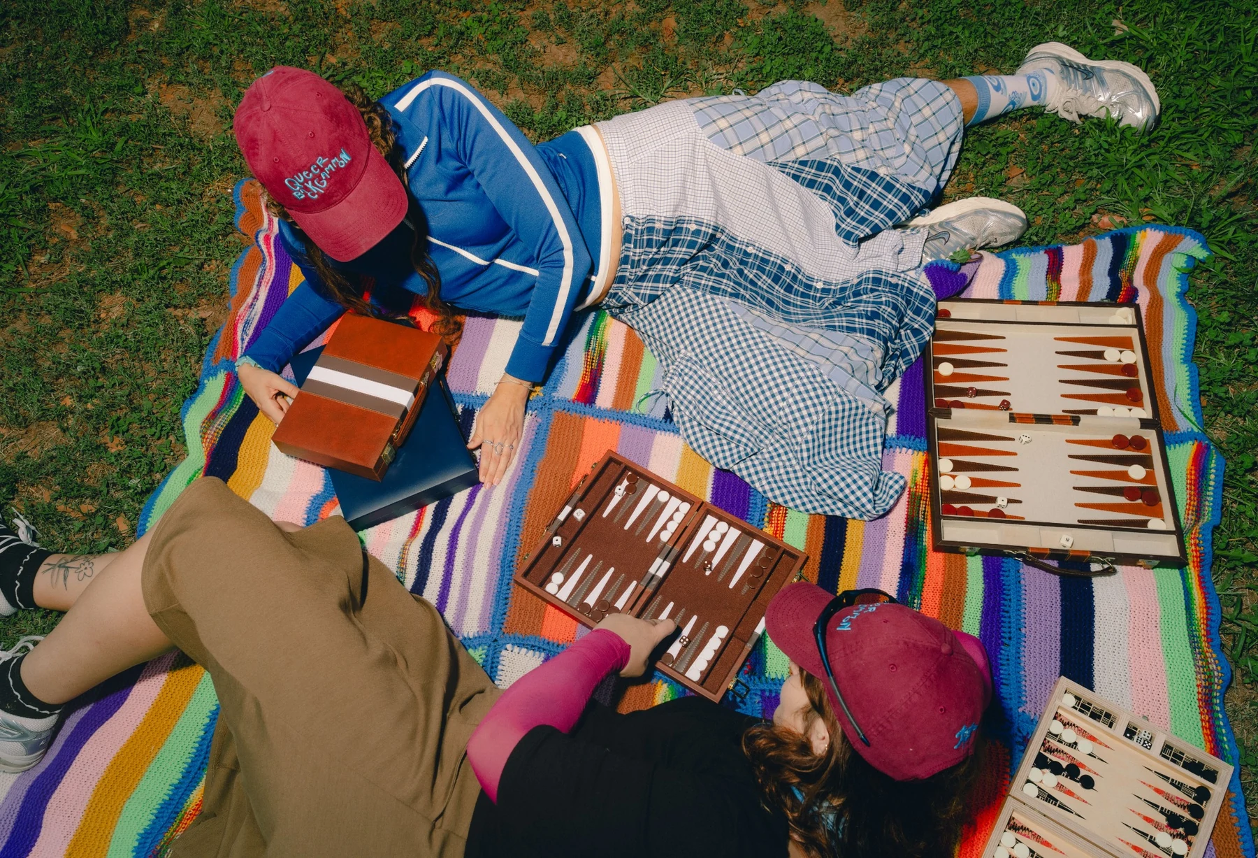 chosen family hat at a backgammon picnic